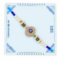 Elegant Evil Eye Pearl Rakhi with Blue Beads